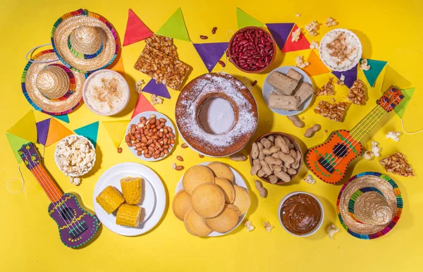 stock image Traditional Festa Junina Summer Festival Carnival Food. Traditional Brazilian Festa Junina dishes and snacks - popcorn, peanuts, corn cake,beans, cookie, pacoca, with holiday decor and accessories