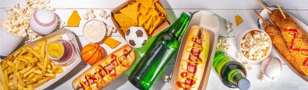 stock image Traditional sport stadium foods and beer background, Set of various baseball, basketball, football fans and stadium snacks, chips, sauces, hot dogs with beer bottles and fan accessories 