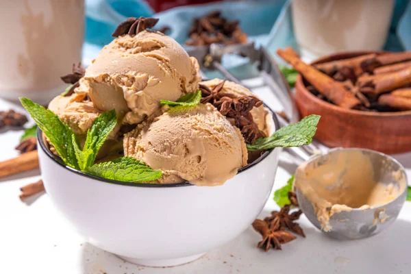 Spicy thai tea ice cream balls, asian indian masala spicy gelato with spices and mint, alternative vegan keto summer cold dessert with coconut cream and thai tea