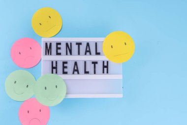 Positive thinking, mental health, ability to live without stress concept. world mental health day background. Multicolored paper emoticons with different moods clipart