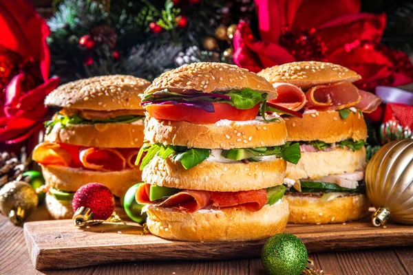 Christmas panettone gastronomico. Pan Brioche salato Panettone gastronomico Italian Christmas, New Year antipasto appetizer sandwiches, with sausage, meat, cheese, olives, salmon fish