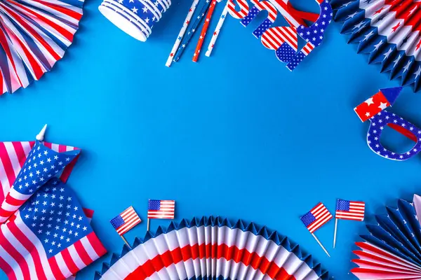 Happy Labor Day, Presidents Day, Fourth of July Independent Day, Memorial day, Columbus day background. Blue background with USA flag color paper fans and decorations, party accessories