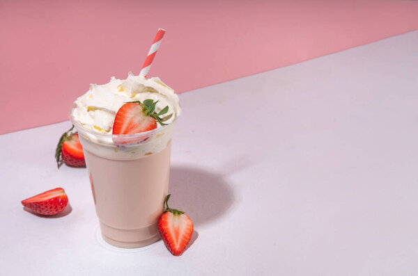 Strawberry milkshake or smoothie, summer fruit cocktail with fresh strawberries, on white pink background, bar menu banner or background, cafe drinks mockup