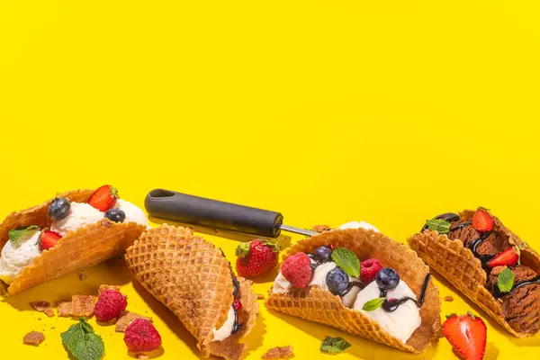 stock image Various sweet taco ice creams. Waffle taco shells with chocolate and vanilla flavour ice cream with different fruits, berry, toppings