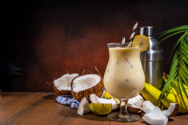 Banana coconut cocktail, fruit tropical mocktail with whipped creamy fruit 