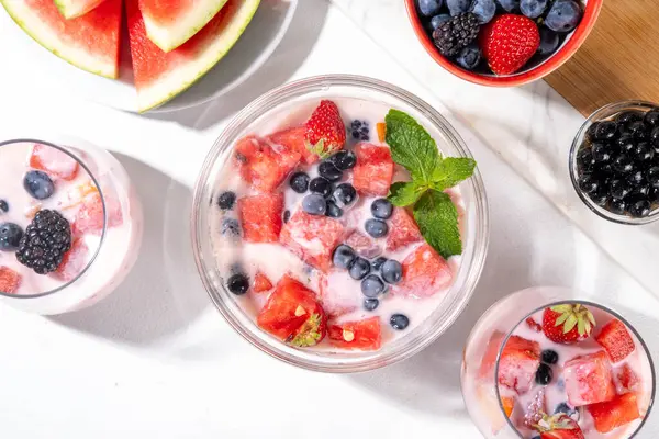 stock image Subak Hwachae cocktail, Korean traditional watermelon punch salad drink, with a lot of fruit slices, with tapioca boba pearls, in glass and bowl for party, copy space