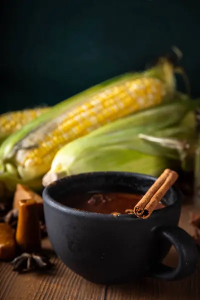 Stock image Mexican Champurrado, atole de cacao. Corn Chocolate hot spicy drink with cinnamon. Traditional Festive latin american Beverage, Dia de muertos, Cinco de Mayo, Christmas holiday food