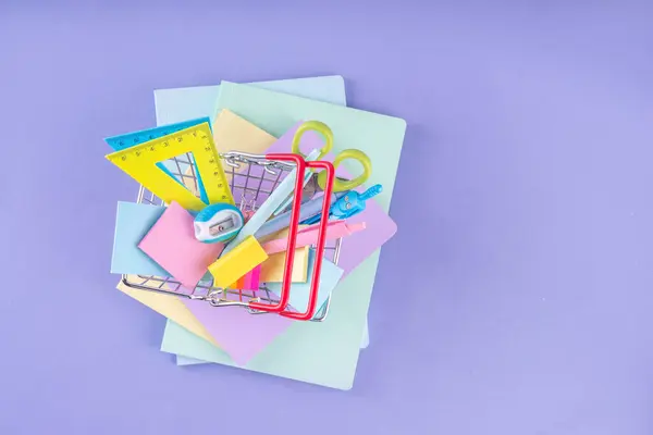 stock image Back to school, school bazaar, school accessories sale background. Bright color background with school supplies, bag, notepads, pens, books, bags with pencil stand, backpack, pencil case copy space