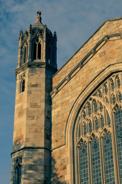 Detail from a window of the dining hall on the Law Quad - the campus of the University of Michigan Law School (Ann Arbor) at Sunset. clipart