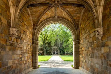 Archway at the Law Quadrangle, the campus of the University of Michigan Law School in Ann Arbor. In the background you can see the entrance to the reading room. clipart