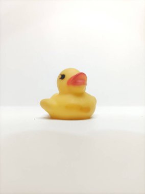 This adorable yellow rubber duck, with its classic design and cute expression, is perfect for bath time fun or as a charming decoration for any space. clipart