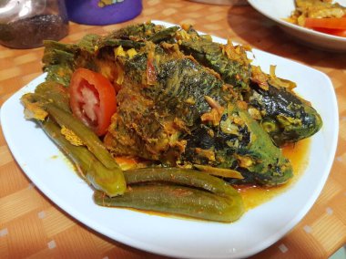 Batakistan mutfağı arsik sazan balığı, Arsik Batak Toba 'nın Endonezya baharatlı balık tabağıdır.