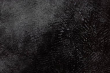 Bu derin, dokulu siyah arkaplan çeşitli tasarım, medya ve sanatsal uygulamalar için mükemmeldir.