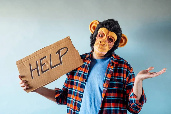 Man Monkey Mask Cardboard Sign Says Help — Stock Photo, Image