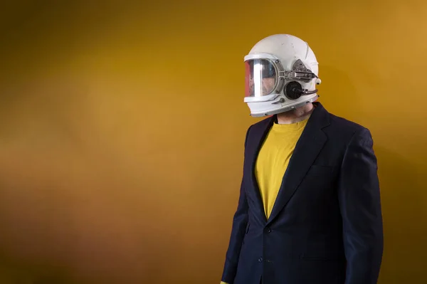 Businessman with astronaut helmet looking to the side