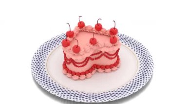 Kalp şeklinde kek ve tabakta kırmızı kiraz.