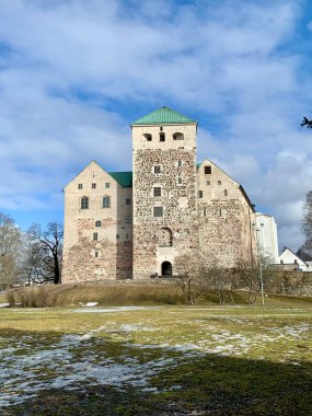 Turku Castle Standing Proud Under a Bright Winter Sky clipart