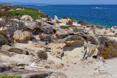 rocks in the sea on the Diaporos Island, Sithonia Peninsula - Greece clipart