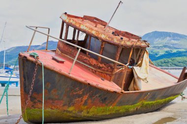 old wooden boat in the harbor clipart