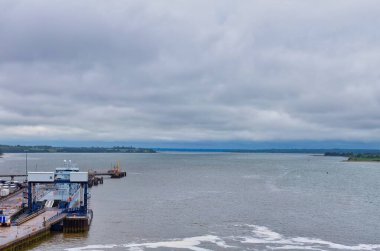 beautiful seascape view of a small port with a large sea on a cloudy day. in Harwich - Tendring district - Essex county - United Kingdom clipart