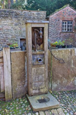 old water fountain in Rufford Old Hall - Rufford - Lancashire - united kingdom clipart