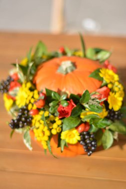 a beautiful bouquet of flowers on a wooden table.