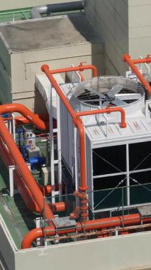 Industrial ventilation system on roof of skyscraper or high buildings. Fan turns in protective casing. Heating, ventilation and air conditioning HVAC