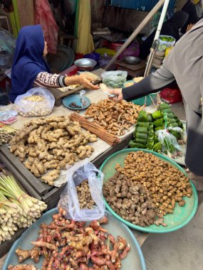 Market Stall Selling Fresh Ginger and Spices clipart