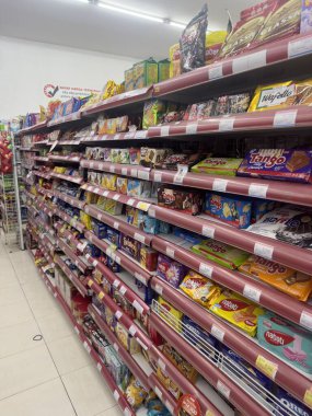 Convenience Store Shelves Stocked With Snacks clipart