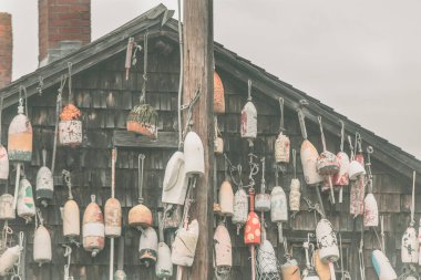 Buidling Exterior Decorated with Maine Lobster Buoys clipart