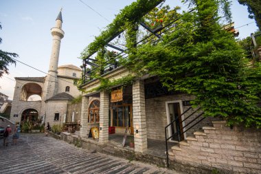 Gjirokastra Albania - July 3. 2023: The Bazaar mosque and restaurant clipart