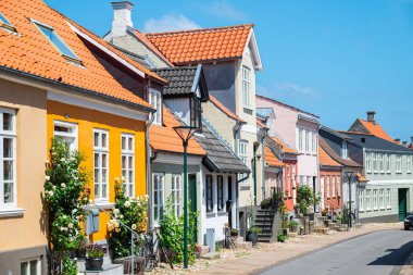 Buildings in city center of Middelfart in Denmark on a sunny summer day clipart