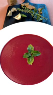 Beetroot soup with fresh greens, garlic , and smooth textures showcases low-calorie delight. Vibrant presentation highlights light, nutrient-packed, satisfying plant-based cuisine. clipart