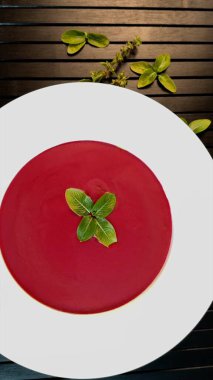 Beetroot soup on black background reflects eco-luxury dining, showcasing organic ingredients, rich colors, and sustainability-focused vegan choices. Vibrant elegance concept. clipart