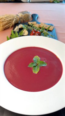 Beetroot soup paired with herbs, vibrant vegetables, and bright garnishes celebrates low-calorie delight. Smooth textures, natural ingredients support light, nutrient-rich, plant-focused dining. clipart