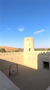 Abu Dhabi, UAE - December 25, 2024:Desert fort reconstruction embodies cultural legacy, merging fort traditions, desert artistry Restoration preserves desert heritage, revitalizes cultural landmarks  clipart