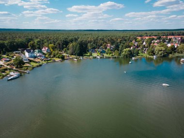 Idyllic top view of the lake Peetzsee and a boats in Gruenheide, Brandenburg at summer time clipart