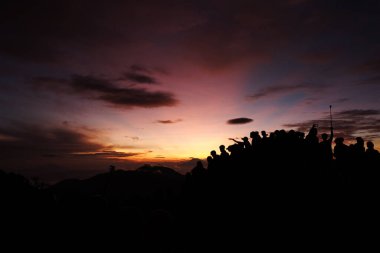 Dieng - Wonosobo, Indonesia - May 29, 2018 People enjoy beautiful Golden Sunrise Sikunir view of the Dieng Wonosobo clipart