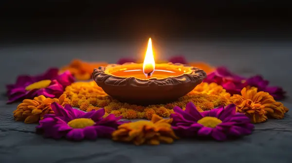 stock image Diwali celebration with a central clay oil lamp glowing over a floral patterned Rangoli made with colorful flower petals. this image was created with artificial intelligence