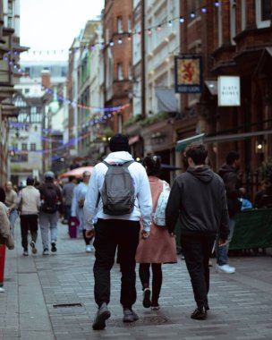 London, England, Apr 30 2023: Carnaby Street street view with tourists walking around clipart