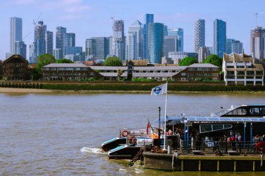 Thames river view from Cutty Sark with a London skyline in the background clipart