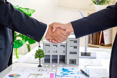 Handshake Real estate broker agent presenting and consult to customer to decision making sign insurance form agreement, buy and sell home model, concerning mortgage loan offer for and house clipart