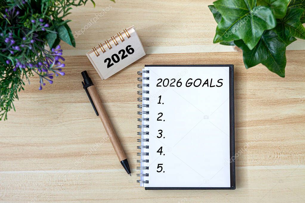 2026 New Year goal, plan, and action concepts. 2026 goals Text on Note Pad with calendar, glasses on the table.New Year's resolutions plan.Happy New Year theme, top view