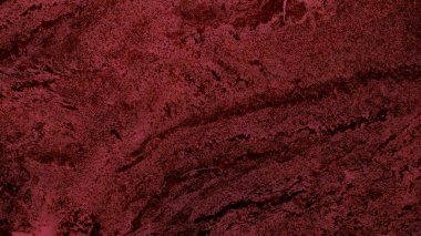 Düzensiz desenleri ve dalgalı eğrileri olan kırmızı mermer..