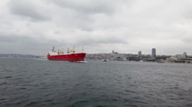 Istanbul, Turkey - December 2018: Crude oil tanker ship sailing along Bosphorus Strait, a busy and important shipping route, with cargo ships of all sizes navigating its waters on a daily basis.