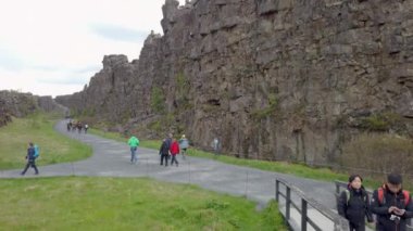 Thingvellir, Iceland - August 2019: Thingvellir National Park with creek of tectonic plates. The park is also a popular destination for outdoor activities, such as hiking, fishing, and scuba diving.