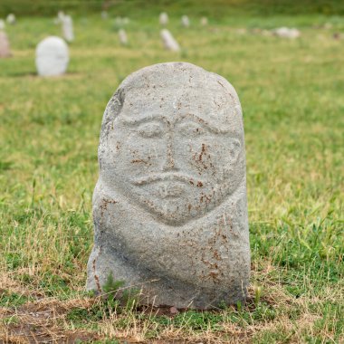 Historical stone sculptures near Old Burana tower that depict various figures and scenes from Kyrgyz history and culture. These sculptures provide insight into country's rich history and traditions