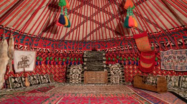 Inside view of a yurt, a circular tent in Kyrgyzstan that works as a house used by dungans and several distinct nomadic groups in Central Asia clipart