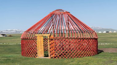 Traditional Yurt tent under construction in Kyrgyzstan. Yurt tents are traditional, portable tents made of felt that are used as a form of accommodation in the country.