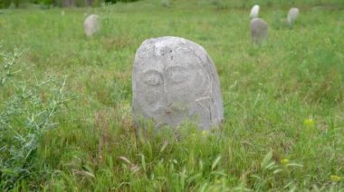 Historical stone sculptures near Old Burana tower that depict various figures and scenes from Kyrgyz history and culture. These sculptures provide insight into country's rich history and traditions